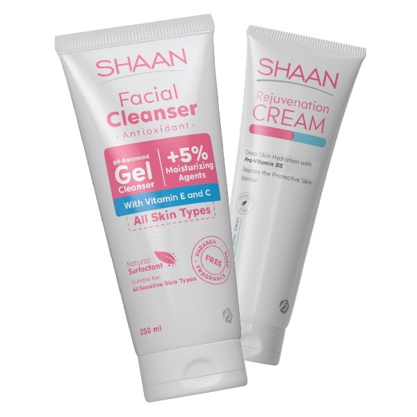 Two tubes of SHAAN brand skin care products, one labeled as 'Facial Cleanser' with antioxidant properties and the other as 'Rejuvenation Cream'. Both are white with blue and pink text and graphics.