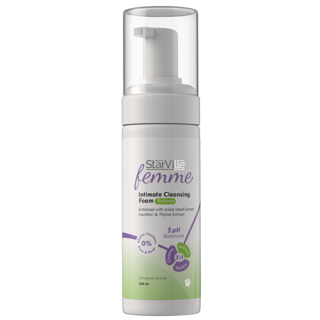 A pump bottle of StarVille Femme Intimate Cleansing Foam with green and white labeling, indicating it is designed for intimate areas with a pH-balancing formula.
