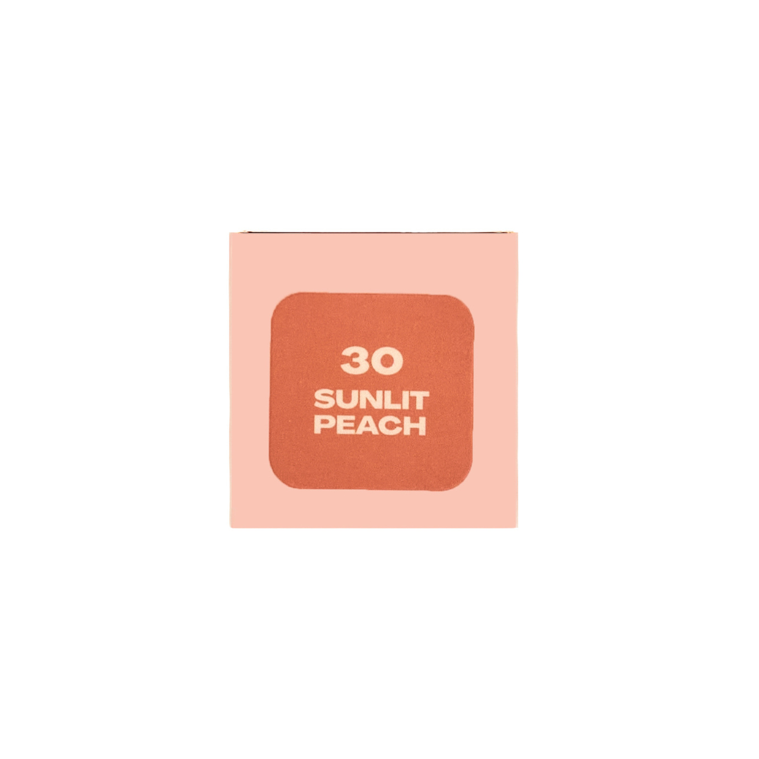 MY-M-ADVANCE Makeup product with '30 Sunlit Peach' label on a light pink background
