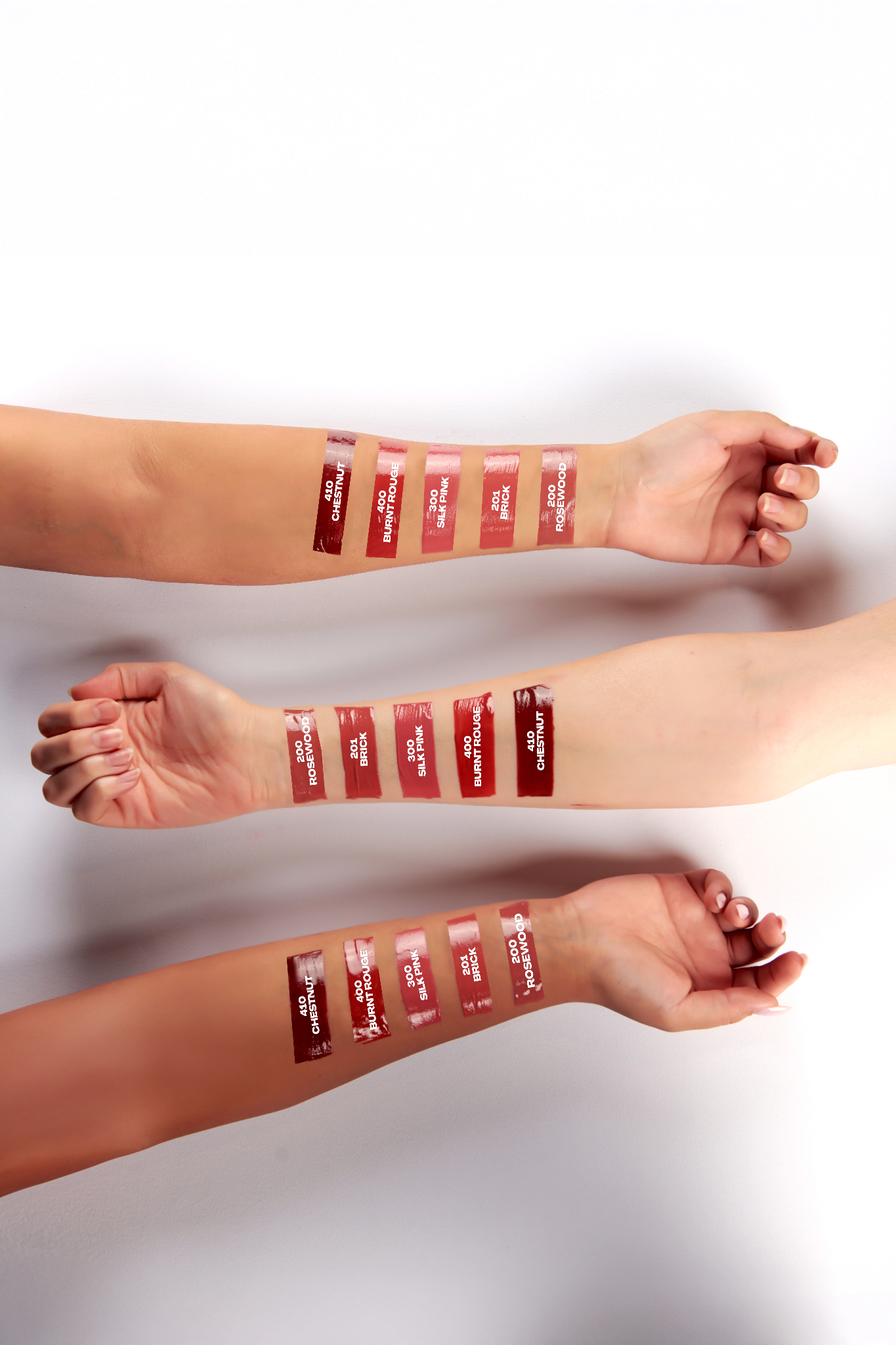 Lipstick swatches on a person's arm