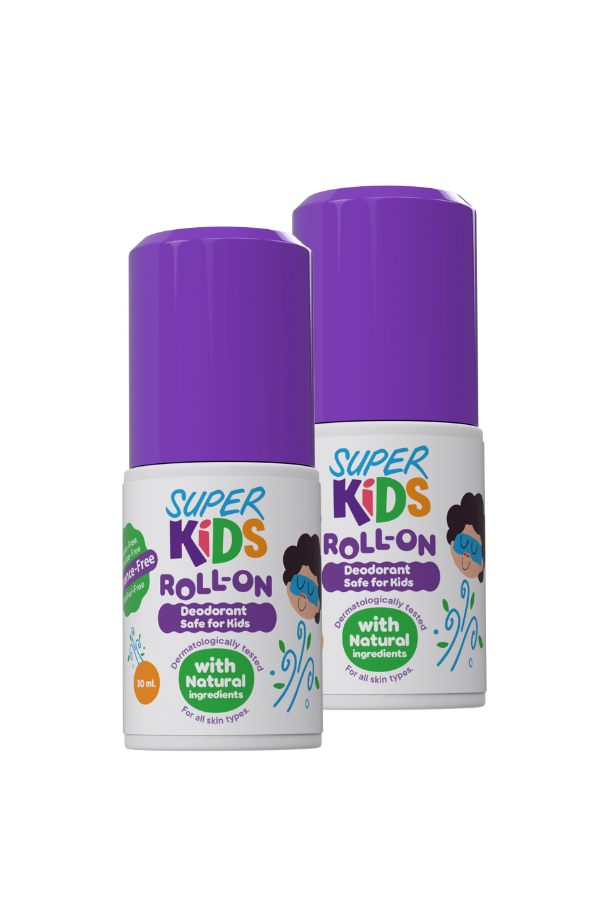 Two roll-on deodorants for kids, one in front view and one in side view, with a purple cap and labelled as 'Superkids ROLL ON' with a graphic of a smiling face. The packaging is predominantly white with purple accents and green text.