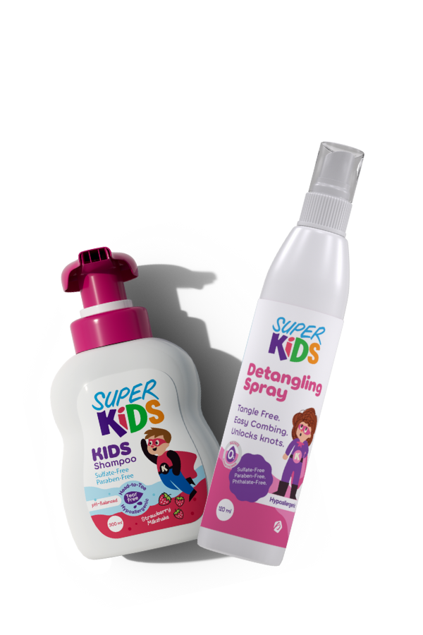 A set of Superkids hair care products, including a bottle of strawberry shampoo and a detangling spray, both with pink and white packaging featuring cartoon children.