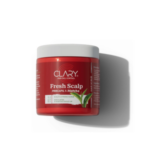 A red plastic jar of Clary Hair Fresh Scalp scrub with green matcha powder 