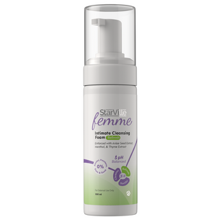 A pump bottle of StarVille Femme Intimate Cleansing Foam with green and white labeling, indicating it is designed for intimate areas with a pH-balancing formula.
