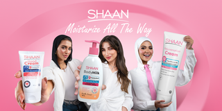 Three women holding Shaan skincare products 
