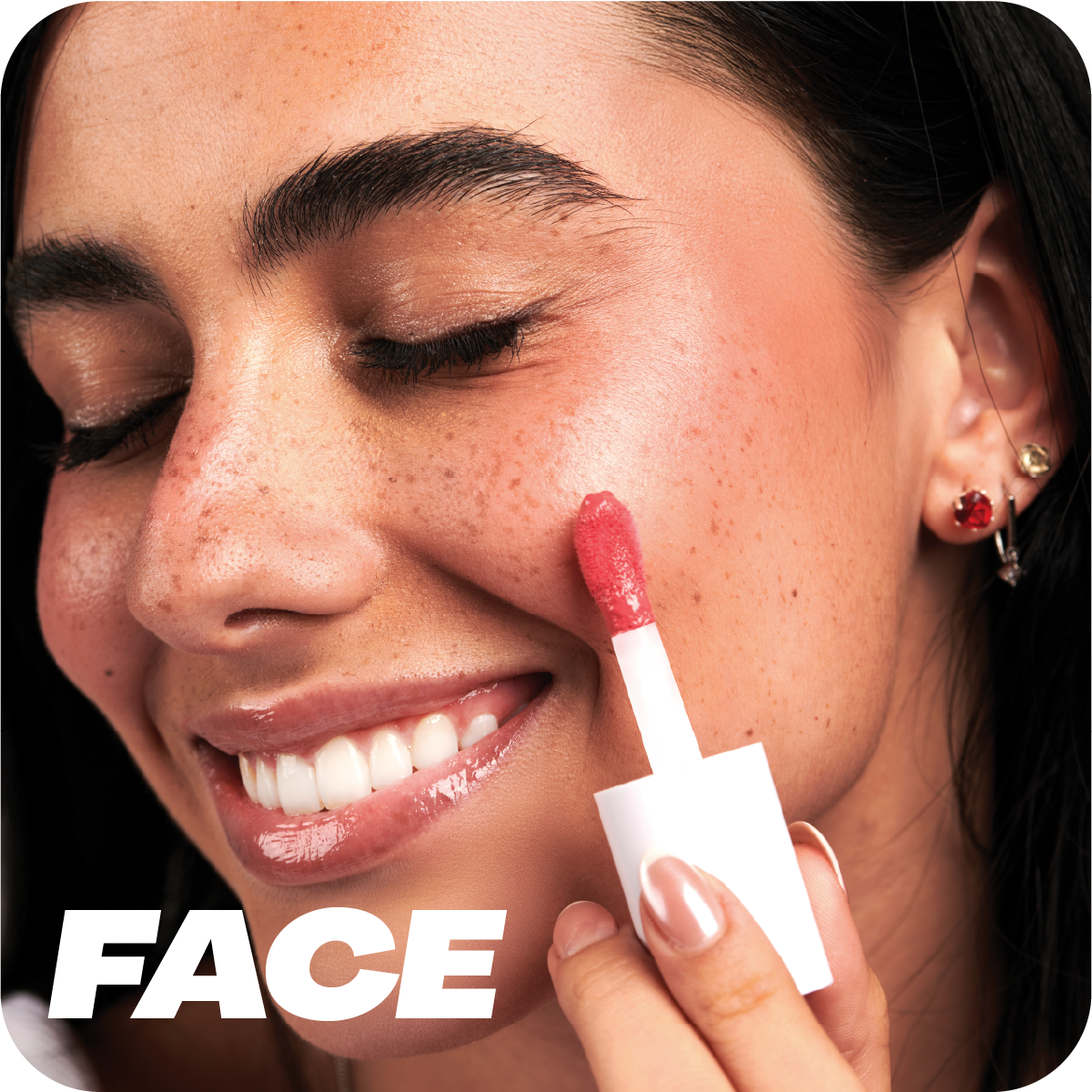 Woman applying red lip balm to her cheek with MY-M-ADVANCE 'FACE.'