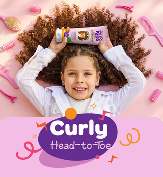 Child with curly hair holding superkids leave in cream by hair care tools, with 'Curly Head-to-Toe'.