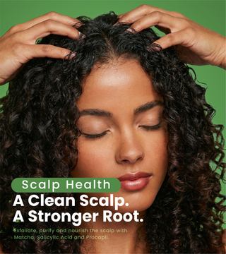 curly hair touching her scalp. scalp health: a clean scalp, a stronger root.