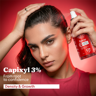 Woman using Clary spray bottle with Capixyl 3% product