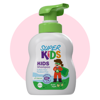 A bottle of Superkids Kids Shampoo with green apple fragrance. The shampoo bottle is white with a green pump, and it features.